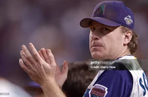 Curt Schilling in the play court rubbing his hands